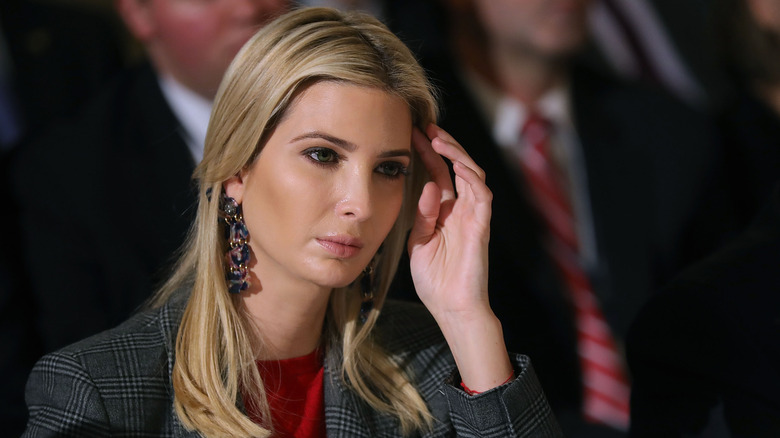 Ivanka Trump touching head