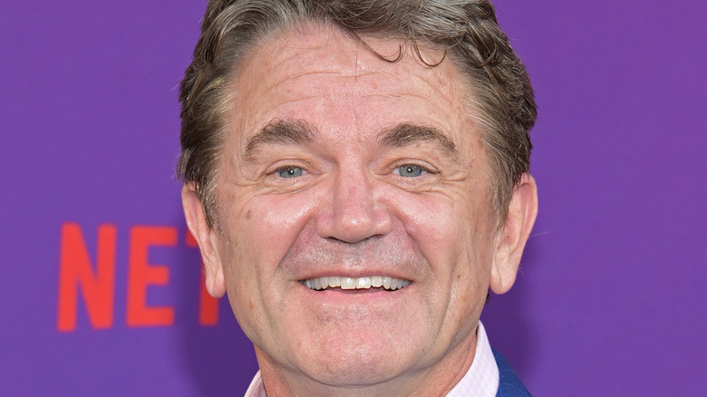 John Michael Higgins grinning