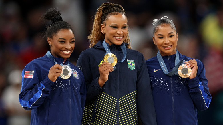 Simone Biles, Rebeca Andrade, Jordan Chiles posing with medals