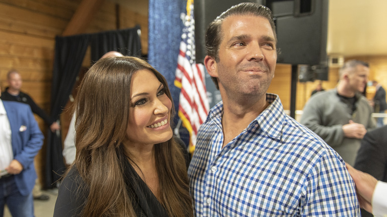 Kimberly Guilfoyle, Donald Trump Jr. smiling