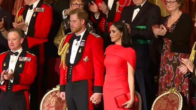 Prince Harry and Meghan Markle standing