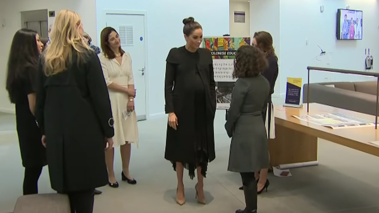 Meghan Markle in a black Givenchy coat