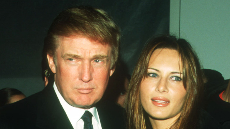 Donald and Melania Trump posing together at an event