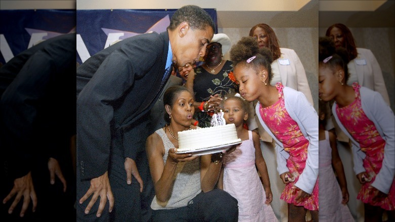 The Obama family blowing out birthday candles