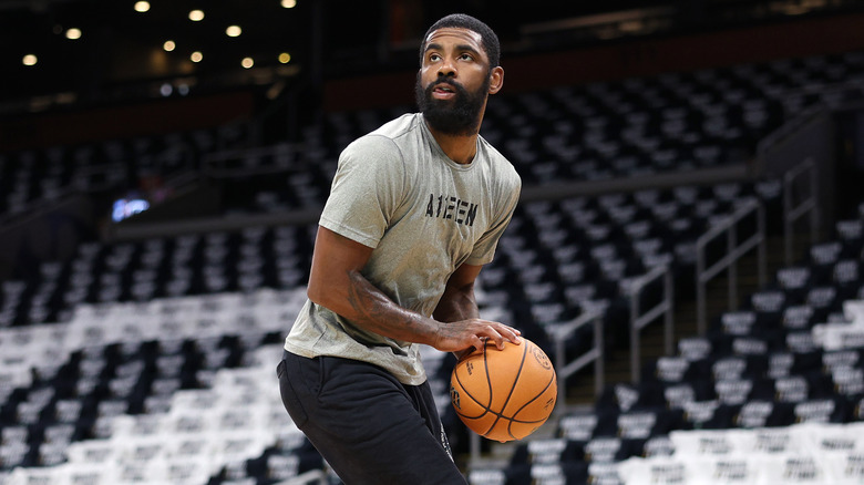 Kyrie Irving playing basketball at practice