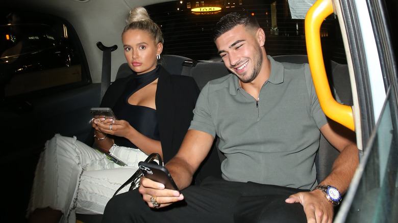 Moly-Mae Hague, Tommy Fury seated in car