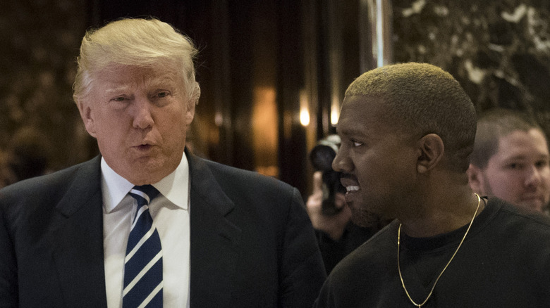 Kanye West laughing with Donald Trump