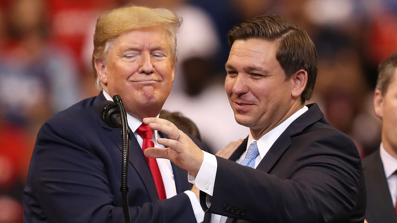 Donald Trump smirking at Ron DeSantis