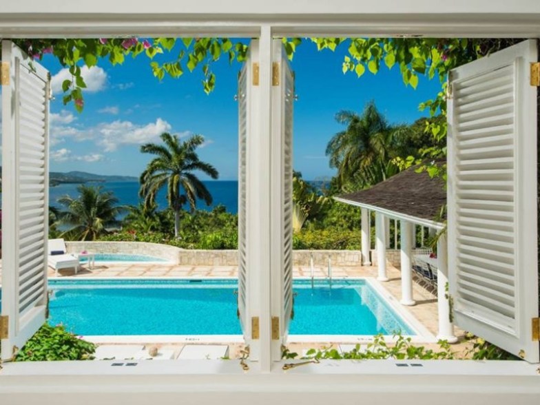 Pool and ocean view at  Round Hill Hotel & Villas