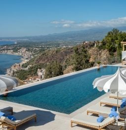 hotel swimming pool overlooking the coast and the mountains