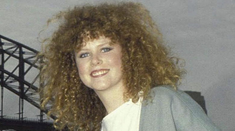 Nicole Kidman with big hair, smiling