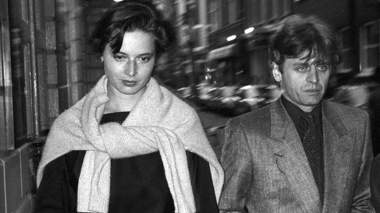 Mikhail Baryshnikov and Isabella Rossellini walking down the street