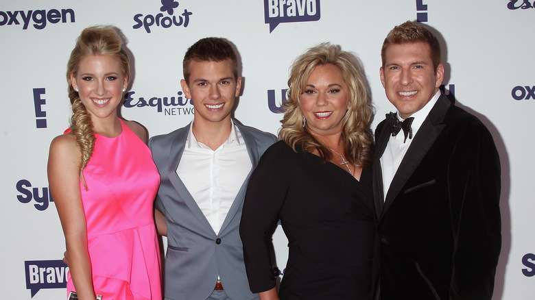 Savannah, Chase, Todd, and Julie Chrisley smiling