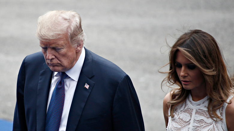 Donald and Melania Trump walking