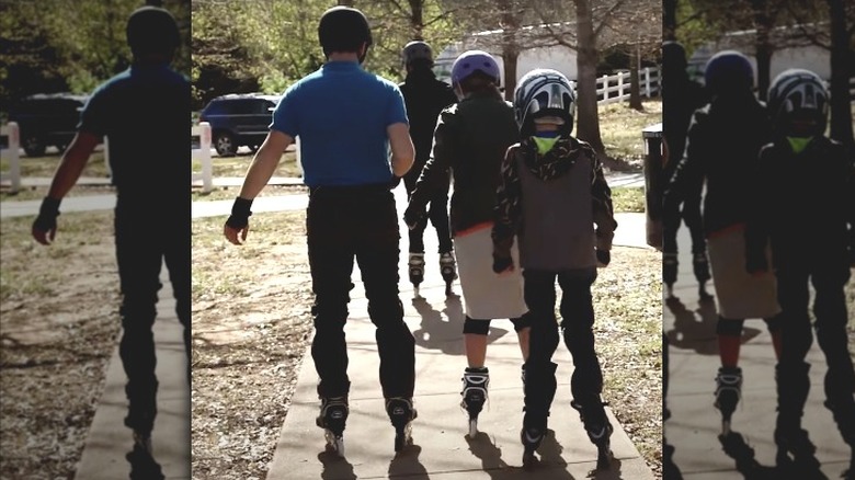 Joe and Kendra Duggar rollerskating with chaperones