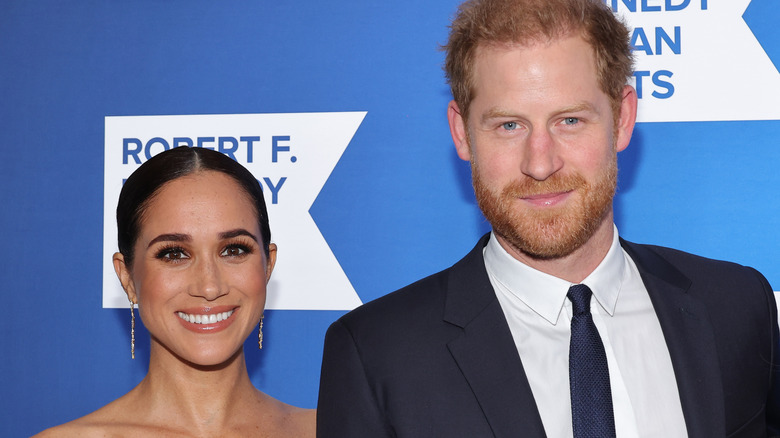 Prince Harry posing with Meghan Markle