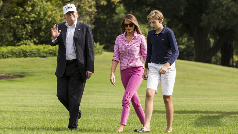 Trump family walking across grass