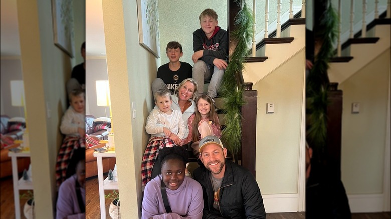 Dave and Jenny Marrs sitting on the staircase with their five children