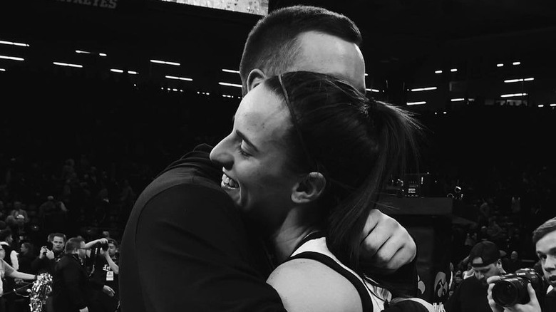 Connor McCaffery and Caitlin Clark hugging