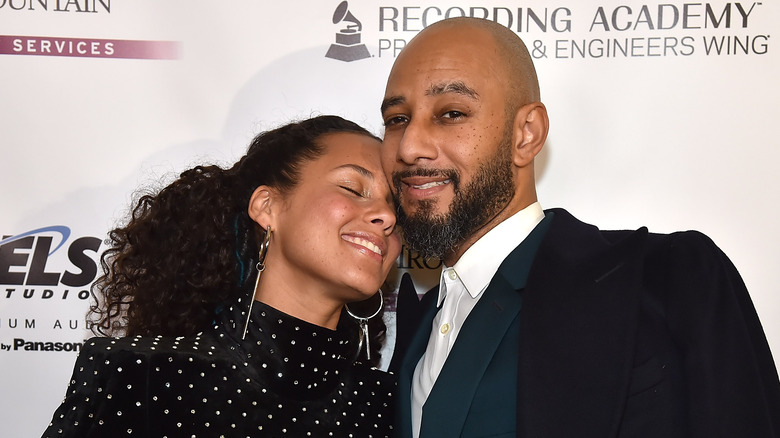 Alicia Keys and Swizz Beatz smiling